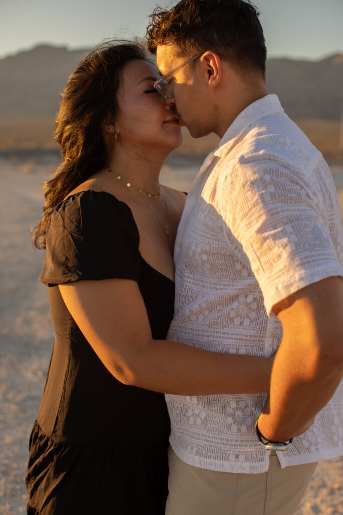 couple kissing taken by Las Vegas portrait photographer Alexis Dean