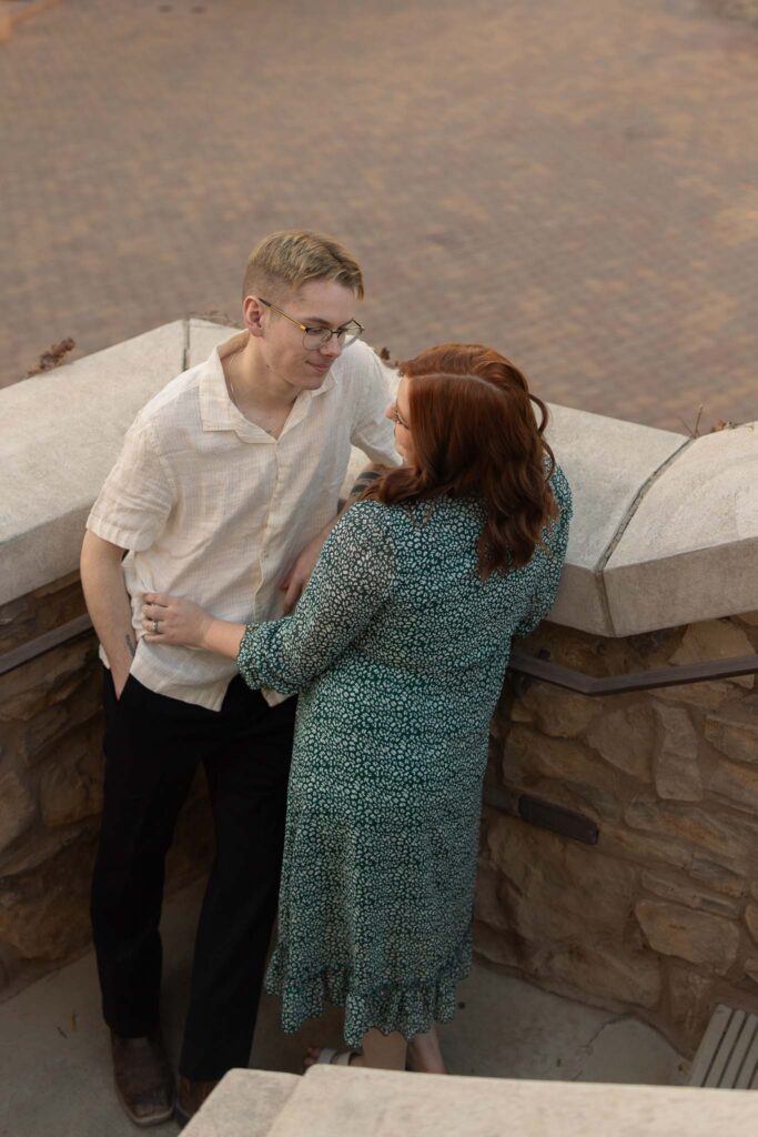 couple starring lovingly at each other on stairs, anniversary session, alexis dean photography, las vegas