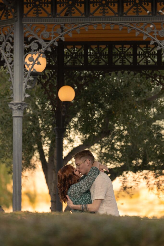 couple kissing at sunset under a gazebo, anniversary session, las vegas wedding photographer alexis dean