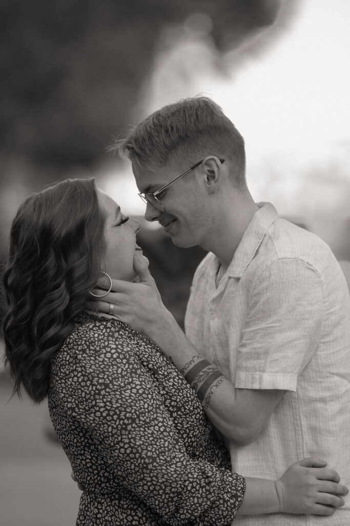 an intimate kiss by the water at lake las vegas, anniversary session, alexis dean - wedding photographer