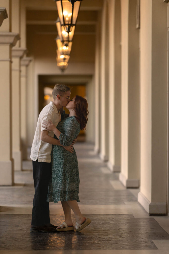 couple kissing in an open corridor in lake las vegas, anniversary session, alexis dean - catholic wedding and portrait photographer