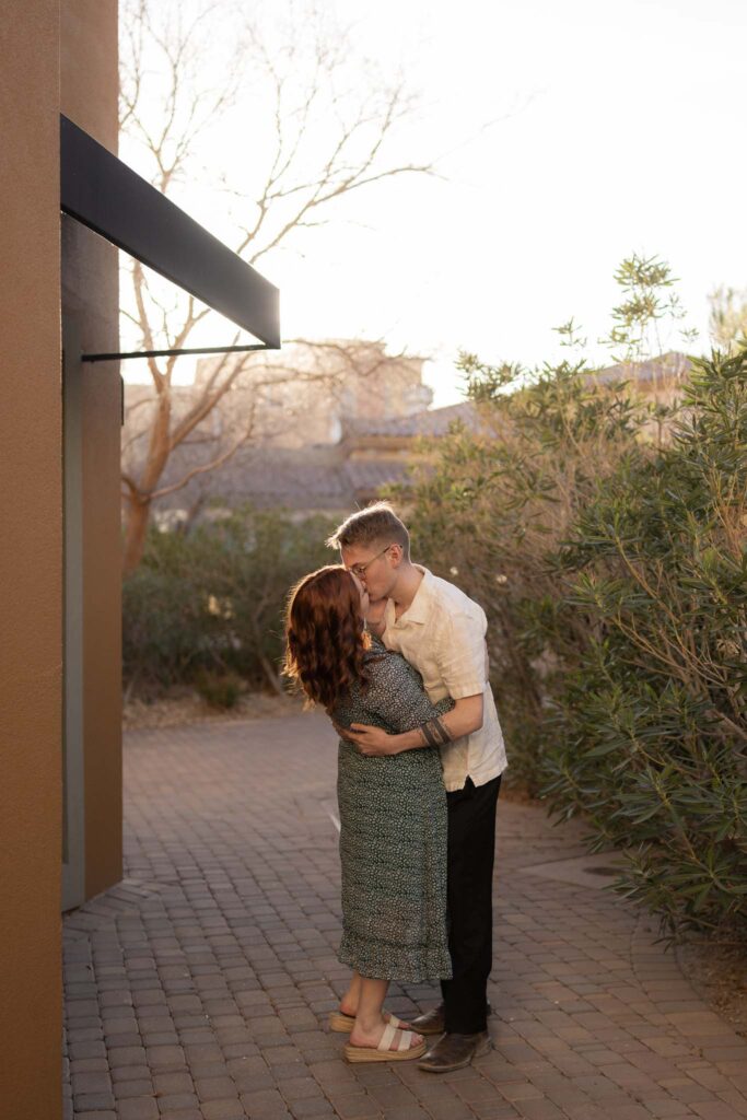 couple kissing in the streets at lake las vegas during an anniversary photo session