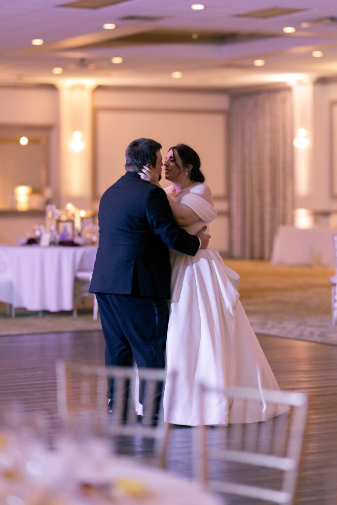 the perfect catholic wedding includes a private last dance, bride and groom enjoying their dance by Catholic wedding photographer